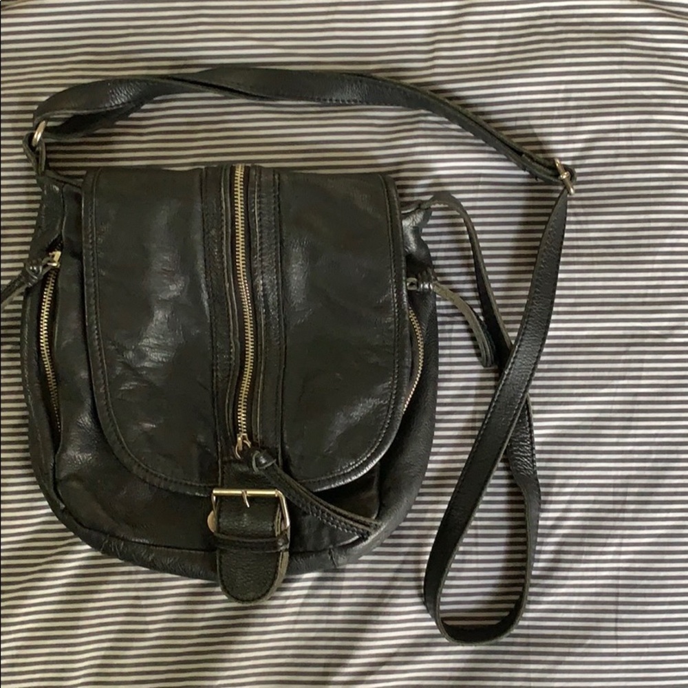 soft, black leather cross body bag with zippers